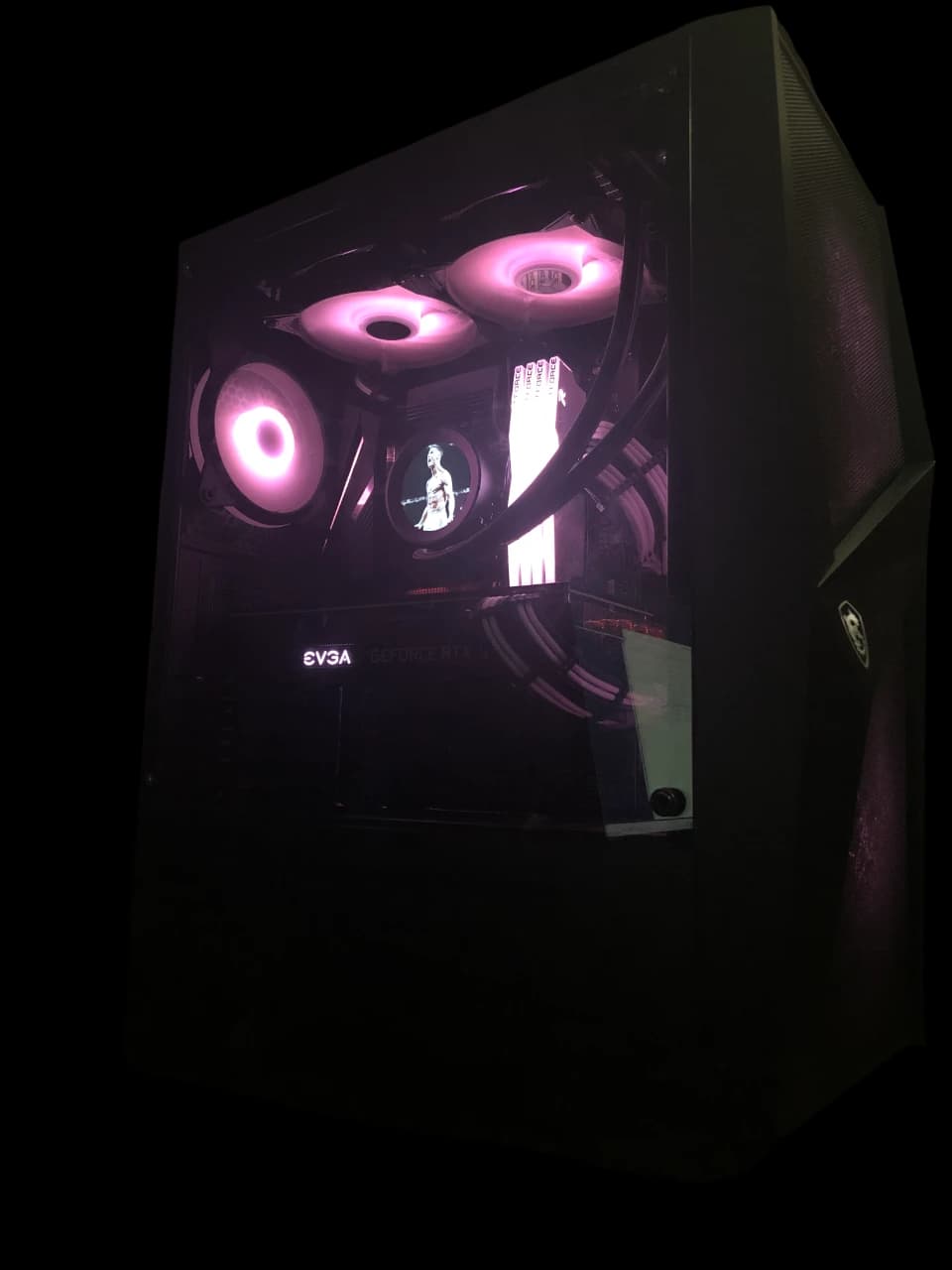 M1 completed gaming PC build with an AMD Ryzen 7 5800X and NVIDIA RTX 3070, white-and-black themed case with pink-purple ARGB lighting.